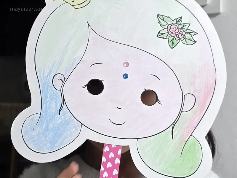 A child wearing a hand-colored paper princess mask with pastel hair.